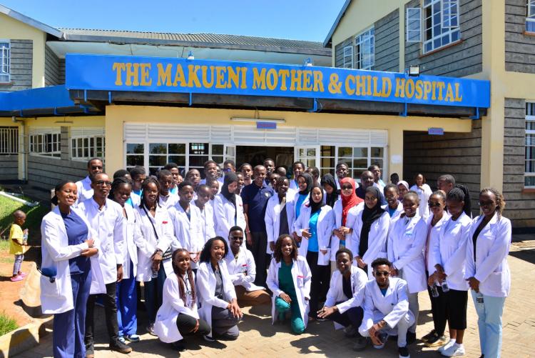 H.E Mutula with the medical students and team